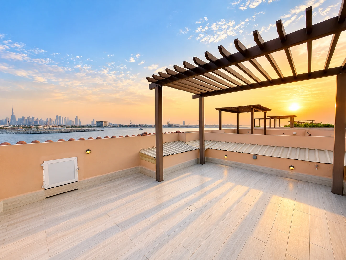 Rooftop terrace overlooking the water at sunset